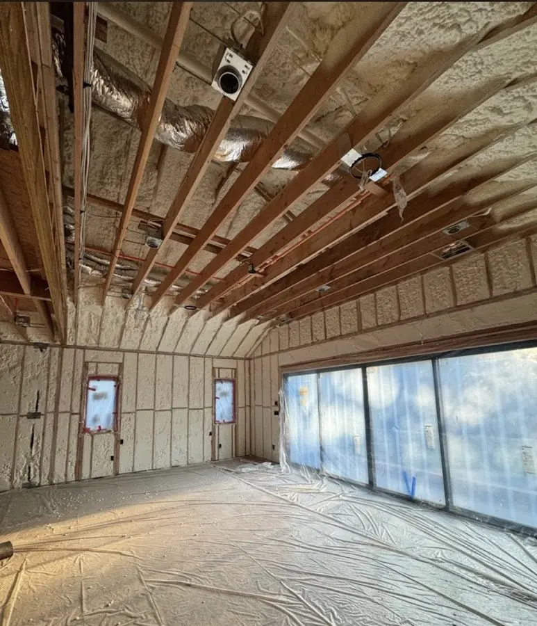 Interior walls and ceiling insulated with spray foam during new construction in Bigfork